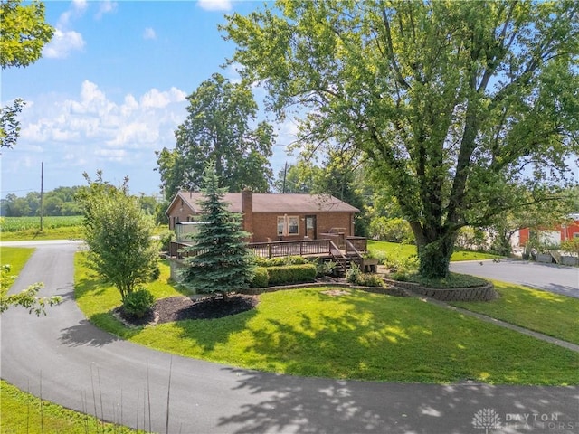 19551 US Highway 68, Fayetteville, OH 45118 - view of front of property with a front lawn, a wooden deck, and brick siding