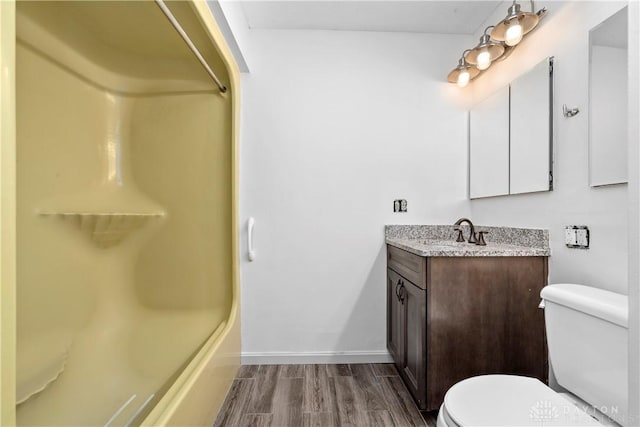 19551 US Highway 68, Fayetteville, OH 45118 - full bathroom featuring vanity, wood finished floors, and washtub / shower combination