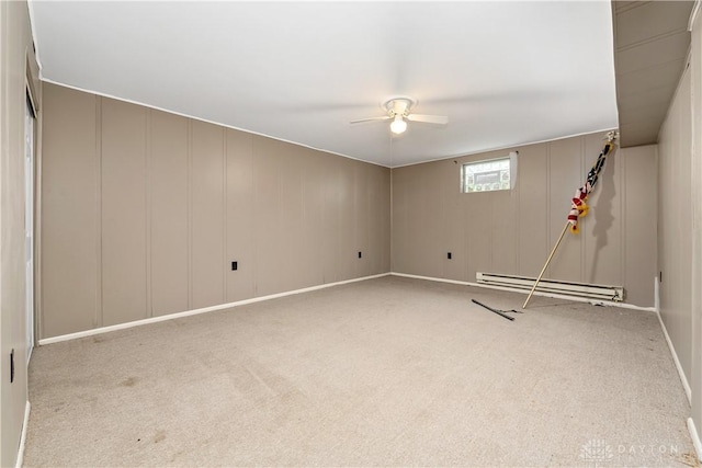 19551 US Highway 68, Fayetteville, OH 45118 - unfurnished room featuring a baseboard radiator, carpet flooring, a ceiling fan, and a decorative wall