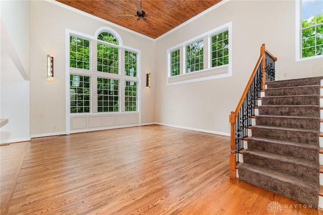 3190 Fox Run Dr, Hamilton, OH 45013 - unfurnished living room with ornamental molding, light wood-style floors, wooden ceiling, healthy amount of natural light, and stairway
