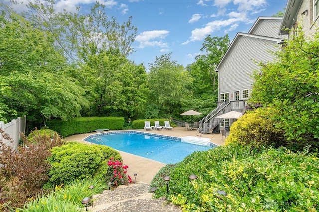 3190 Fox Run Dr, Hamilton, OH 45013 - swimming pool with stairs, a patio area, and a diving board