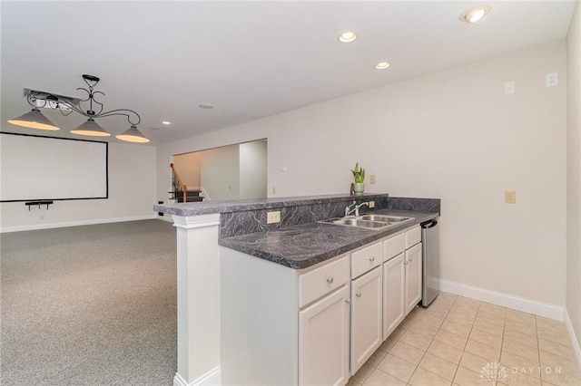 3190 Fox Run Dr, Hamilton, OH 45013 - kitchen featuring a peninsula, white cabinets, dark countertops, recessed lighting, and pendant lighting