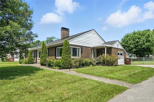 4503 Central Ave, Middletown, OH 45044 - ranch-style home featuring brick siding, an attached garage, a chimney, and concrete driveway