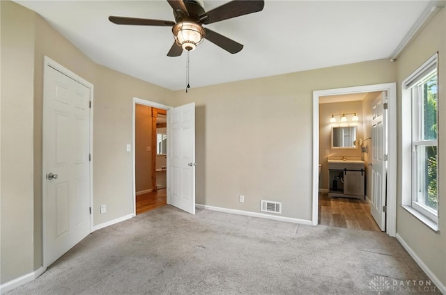 4503 Central Ave, Middletown, OH 45044 - unfurnished bedroom featuring carpet, ensuite bath, and ceiling fan