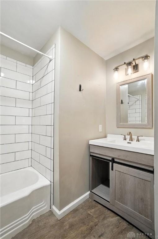 4503 Central Ave, Middletown, OH 45044 - bathroom with wood finished floors, vanity, and bathing tub / shower combination