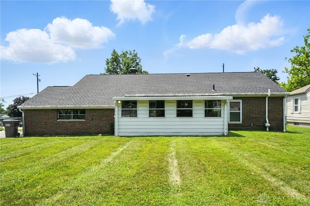 4503 Central Ave, Middletown, OH 45044 - rear view of house with a lawn and brick siding