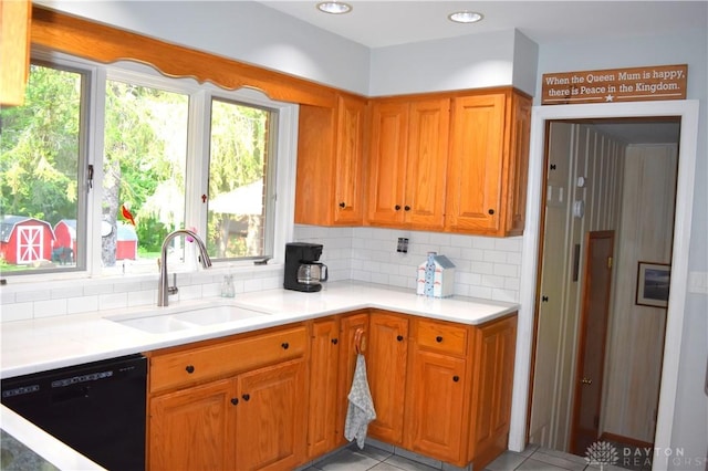 3235 W Ziegler Rd, Piqua, OH 45356 - kitchen with black dishwasher, decorative backsplash, light countertops, and light tile patterned flooring