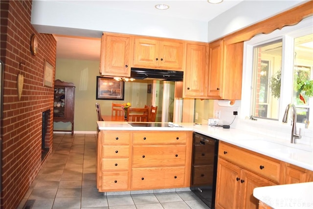 3235 W Ziegler Rd, Piqua, OH 45356 - kitchen with black appliances, under cabinet range hood, light tile patterned flooring, light countertops, and a peninsula
