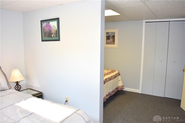 3235 W Ziegler Rd, Piqua, OH 45356 - bedroom featuring dark colored carpet, a closet, and a drop ceiling