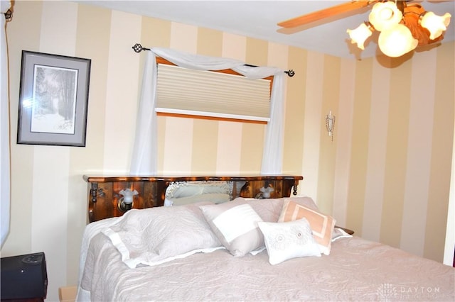 3235 W Ziegler Rd, Piqua, OH 45356 - bedroom with wallpapered walls and a ceiling fan