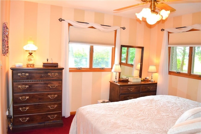 3235 W Ziegler Rd, Piqua, OH 45356 - bedroom with wallpapered walls and a ceiling fan