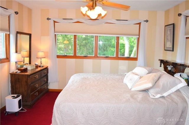 3235 W Ziegler Rd, Piqua, OH 45356 - bedroom featuring wallpapered walls, dark colored carpet, and a chandelier