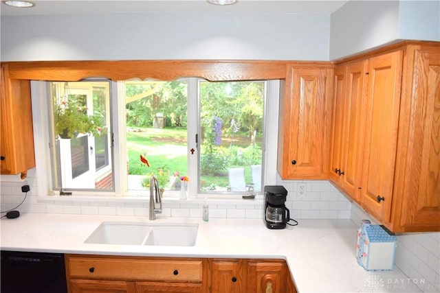 3235 W Ziegler Rd, Piqua, OH 45356 - kitchen with dishwasher, tasteful backsplash, and light countertops