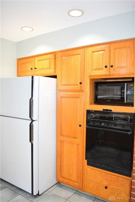 3235 W Ziegler Rd, Piqua, OH 45356 - kitchen featuring black appliances and light tile patterned flooring