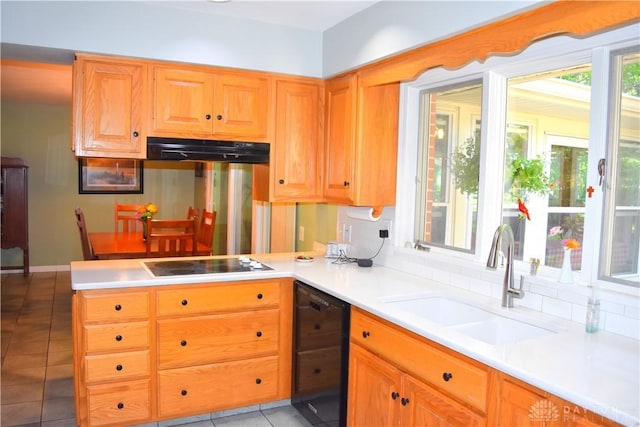 3235 W Ziegler Rd, Piqua, OH 45356 - kitchen featuring extractor fan, black appliances, a peninsula, light tile patterned floors, and light countertops