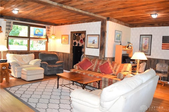 3235 W Ziegler Rd, Piqua, OH 45356 - living area featuring a wooden ceiling with exposed beams, a wainscoted wall, wood finished floors, wallpapered walls, and wooden walls