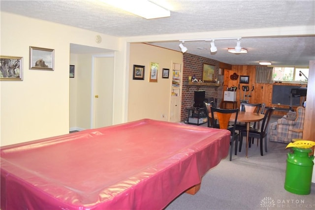 3235 W Ziegler Rd, Piqua, OH 45356 - recreation room featuring carpet, billiards, a fireplace, a textured ceiling, and track lighting