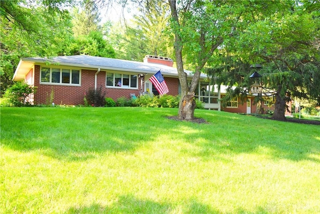 3235 W Ziegler Rd, Piqua, OH 45356 - view of front of house with a front yard and brick siding