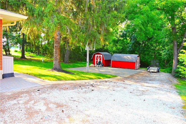 3235 W Ziegler Rd, Piqua, OH 45356 - view of green lawn featuring a storage unit