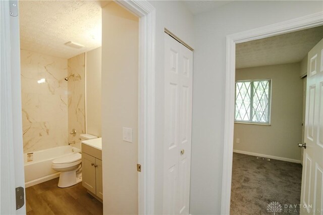 9446 Haddington Ct Unit 200, Cincinnati, OH 45251 - bathroom with vanity, a closet, a textured ceiling, and bathing tub / shower combination