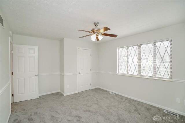 9446 Haddington Ct Unit 200, Cincinnati, OH 45251 - unfurnished bedroom featuring carpet flooring, a textured ceiling, ceiling fan, and a closet