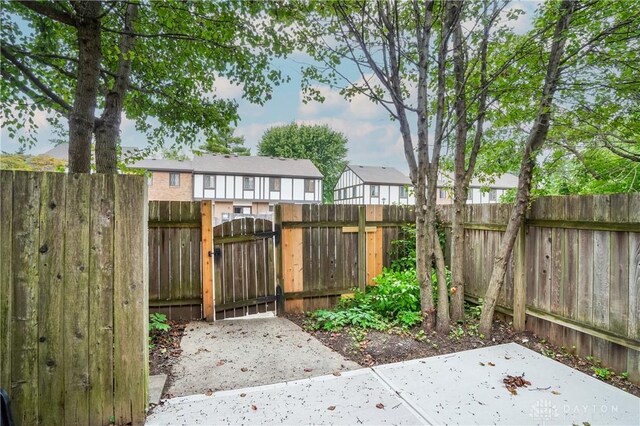 9446 Haddington Ct Unit 200, Cincinnati, OH 45251 - fenced yard with a gate, a patio, and a residential view