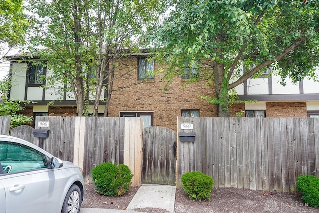 9446 Haddington Ct Unit 200, Cincinnati, OH 45251 - view of front of home with brick siding and a fenced front yard
