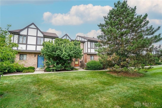 9446 Haddington Ct Unit 200, Cincinnati, OH 45251 - view of front of home with a front yard, stucco siding, and brick siding