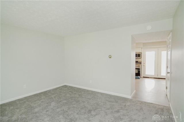 9446 Haddington Ct Unit 200, Cincinnati, OH 45251 - carpeted spare room with a textured ceiling and a smoke detector