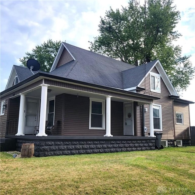 300 S Evans St, Saratoga, IN 47382 - view of front of home featuring a porch and a front yard
