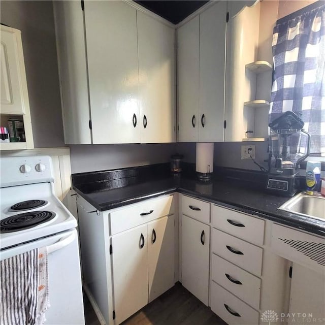 300 S Evans St, Saratoga, IN 47382 - kitchen with electric stove, open shelves, dark countertops, dark wood finished floors, and white cabinets