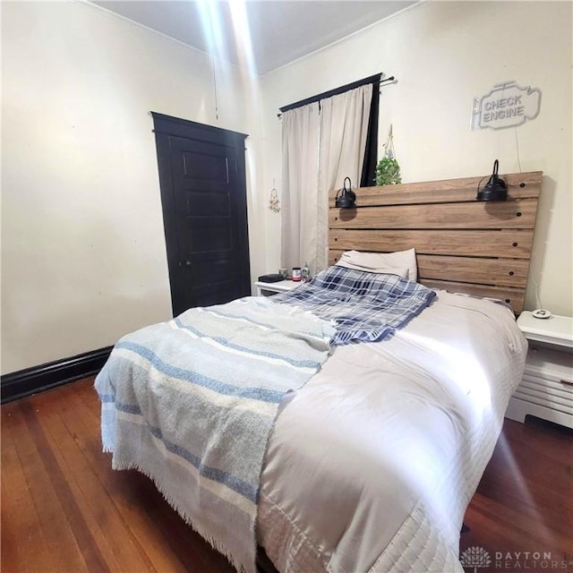 300 S Evans St, Saratoga, IN 47382 - bedroom with hardwood / wood-style flooring