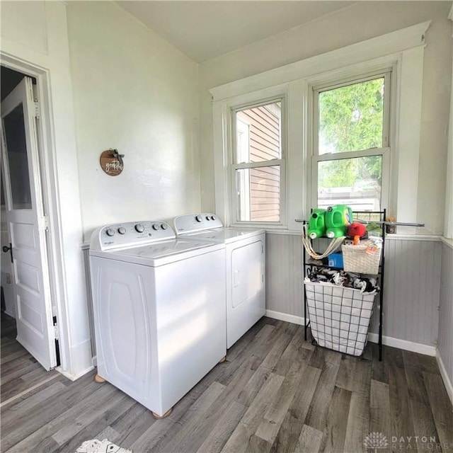 300 S Evans St, Saratoga, IN 47382 - laundry room with washer and dryer, wood finished floors, plenty of natural light, and a wainscoted wall