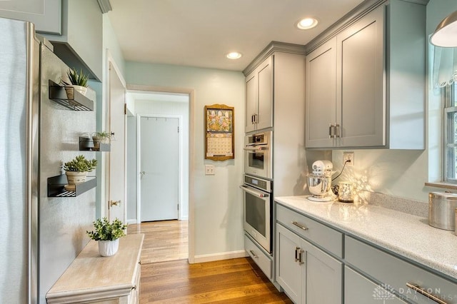 3318 US Route 42, Cedarville Twp, OH 45314 - kitchen with freestanding refrigerator, gray cabinets, wood finished floors, recessed lighting, and light countertops