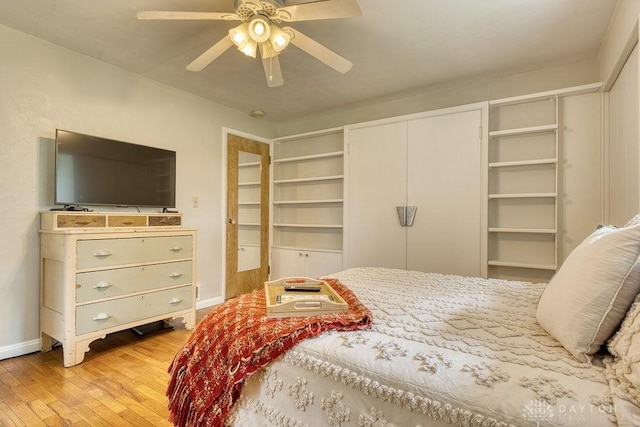 3318 US Route 42, Cedarville Twp, OH 45314 - bedroom featuring light wood-style floors, two closets, and ceiling fan