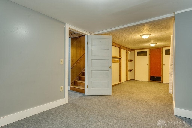 3318 US Route 42, Cedarville Twp, OH 45314 - hallway featuring light carpet, stairway, and a textured ceiling
