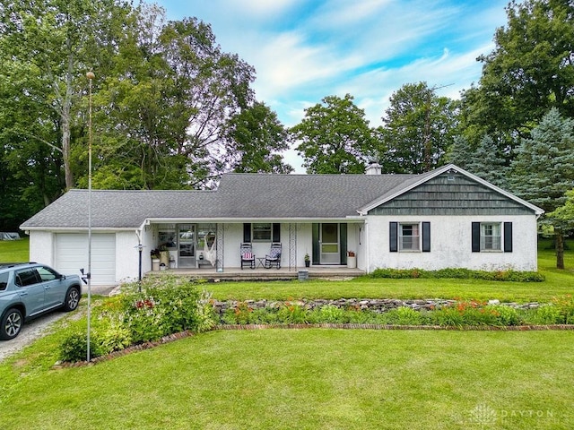 3318 US Route 42, Cedarville Twp, OH 45314 - single story home featuring an attached garage, a porch, a front yard, a chimney, and driveway