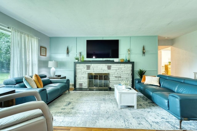 3318 US Route 42, Cedarville Twp, OH 45314 - living area with a stone fireplace and wood finished floors