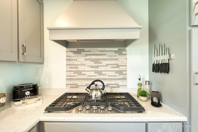 3318 US Route 42, Cedarville Twp, OH 45314 - kitchen featuring premium range hood, stainless steel gas cooktop, light countertops, and backsplash