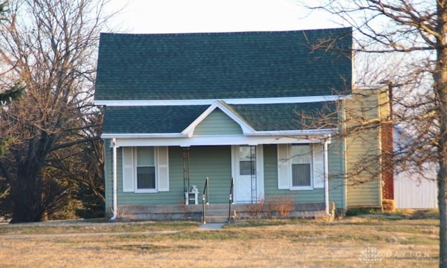 6396 Plymouth Rd, Silver Creek Twp, OH 45335 - view of front of house with roof with shingles, covered porch, and a front yard