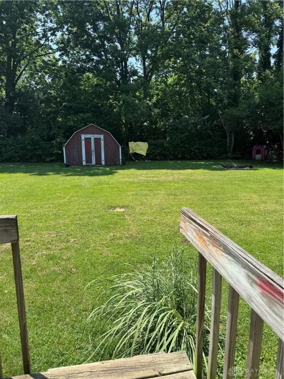 8211 Sue Ave, Franklin, OH 45005 - view of grassy yard with a storage shed