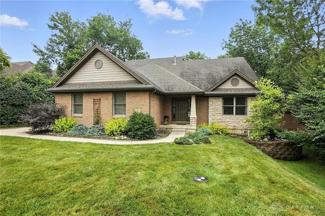 2210 Hidden Woods Blvd, Beavercreek, OH 45431 - ranch-style home featuring a front yard, a shingled roof, and brick siding