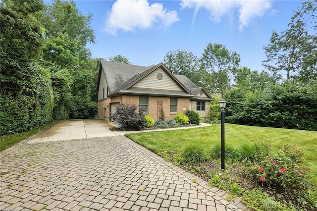 2210 Hidden Woods Blvd, Beavercreek, OH 45431 - view of front of house featuring brick siding, a front lawn, and driveway