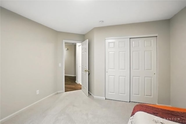 2210 Hidden Woods Blvd, Beavercreek, OH 45431 - unfurnished bedroom featuring carpet and a closet