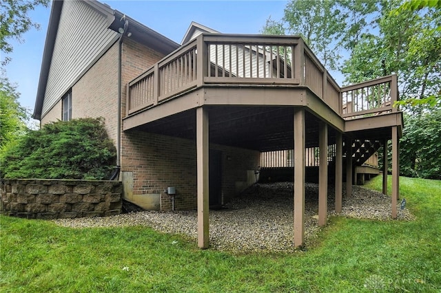 2210 Hidden Woods Blvd, Beavercreek, OH 45431 - rear view of house with a wooden deck, brick siding, a lawn, a carport, and stairway