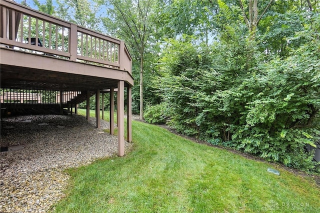 2210 Hidden Woods Blvd, Beavercreek, OH 45431 - view of green lawn featuring a wooden deck and a carport