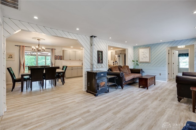 11920 State Route 725, Germantown, OH 45327 - living area featuring a chandelier, light wood-style flooring, a decorative wall, recessed lighting, and wooden walls