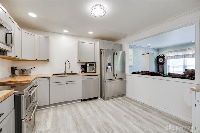 11920 State Route 725, Germantown, OH 45327 - kitchen featuring stainless steel appliances, butcher block countertops, light wood-style floors, and recessed lighting