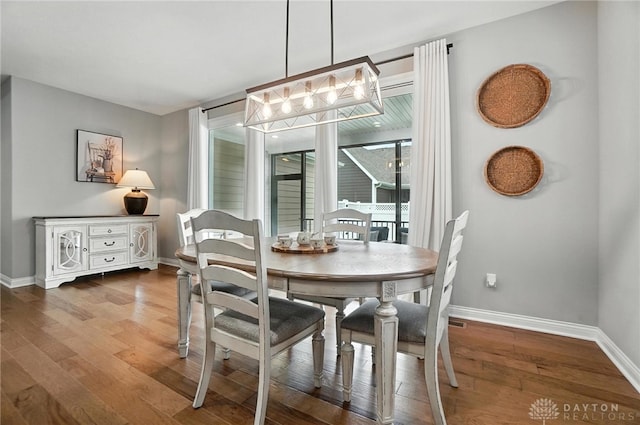 539 Bellasera Dr, Sugarcreek Twp, OH 45440 - dining area with wood finished floors and a chandelier