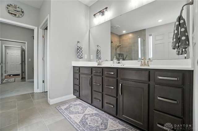 539 Bellasera Dr, Sugarcreek Twp, OH 45440 - bathroom with tiled shower, double vanity, and tile patterned flooring